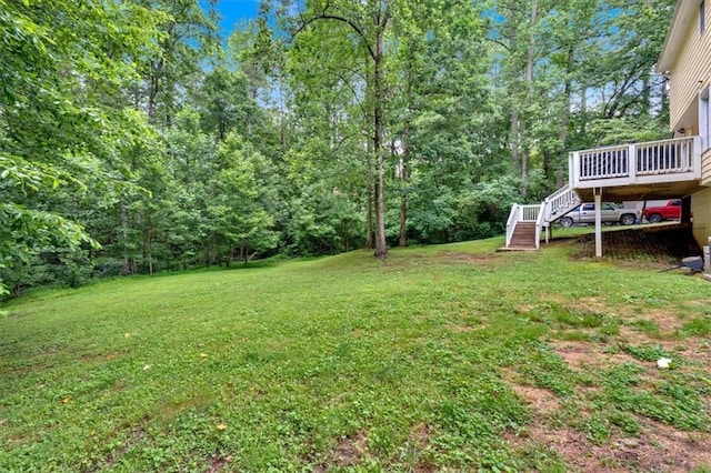 40 Picketts Forge Dr W, Acworth, GA 30101 - view of grassy yard with stairs, a wooden deck, and a forest view