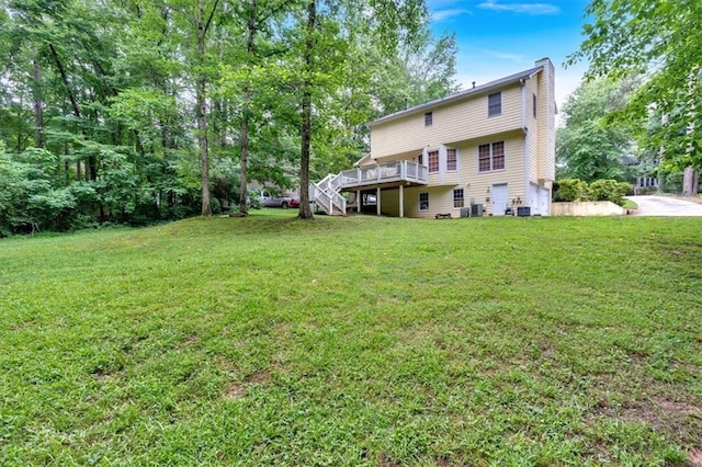 40 Picketts Forge Dr W, Acworth, GA 30101 - back of property with a wooden deck, stairway, a yard, and central air condition unit