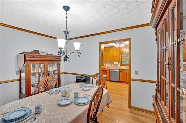 40 Picketts Forge Dr W, Acworth, GA 30101 - dining space with a chandelier, light wood finished floors, crown molding, and a textured ceiling