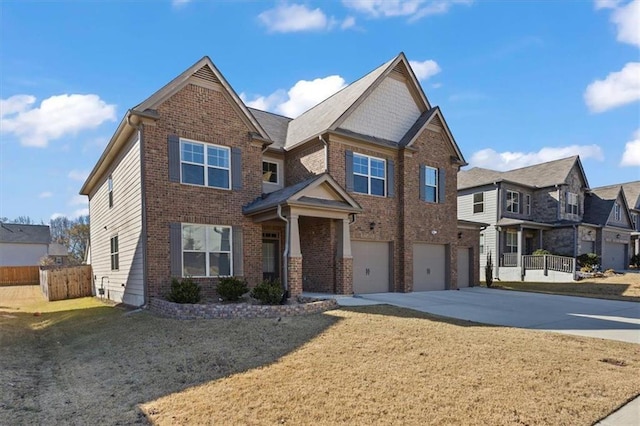 view of front of home featuring a garage and a front lawn