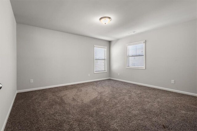 spare room featuring carpet