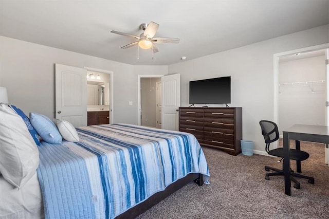 carpeted bedroom featuring connected bathroom, a spacious closet, a closet, and ceiling fan