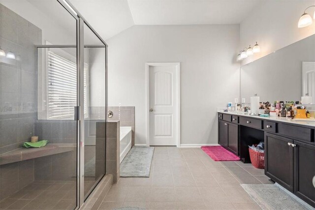 bathroom featuring tile patterned flooring, vanity, lofted ceiling, and shower with separate bathtub