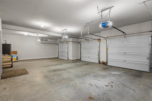 garage featuring a garage door opener