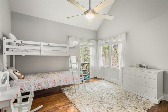 bedroom featuring ceiling fan, lofted ceiling, and wood finished floors