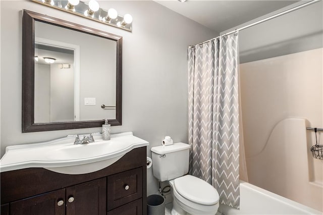 bathroom featuring shower / bath combination with curtain, toilet, and vanity