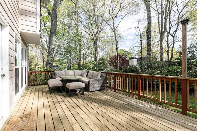 wooden terrace with outdoor lounge area