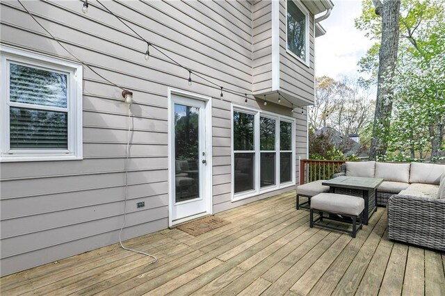 deck featuring outdoor lounge area