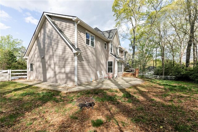 view of property exterior featuring a patio and a fenced backyard