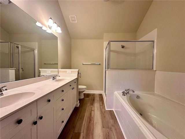 4875 Carre Way, Alpharetta, GA 30022 - bathroom with a bath, a shower stall, wood finished floors, double vanity, and toilet