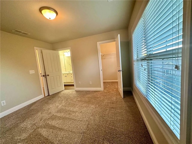 4875 Carre Way, Alpharetta, GA 30022 - unfurnished bedroom featuring baseboards, dark carpet, a spacious closet, a closet, and ensuite bathroom