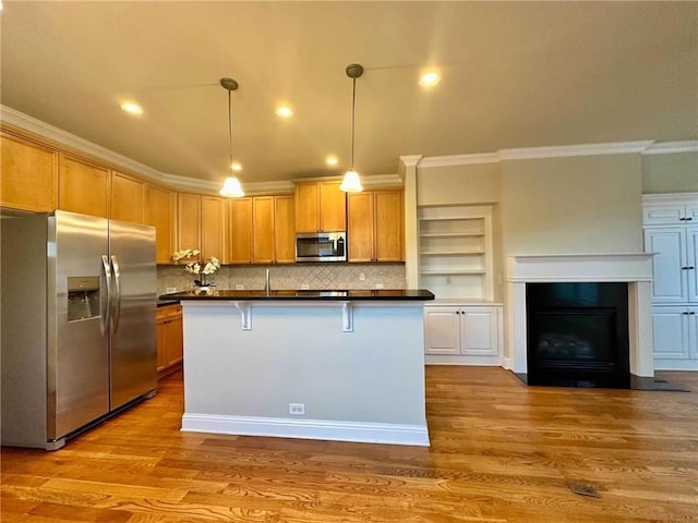 4875 Carre Way, Alpharetta, GA 30022 - kitchen with appliances with stainless steel finishes, crown molding, dark countertops, pendant lighting, and backsplash