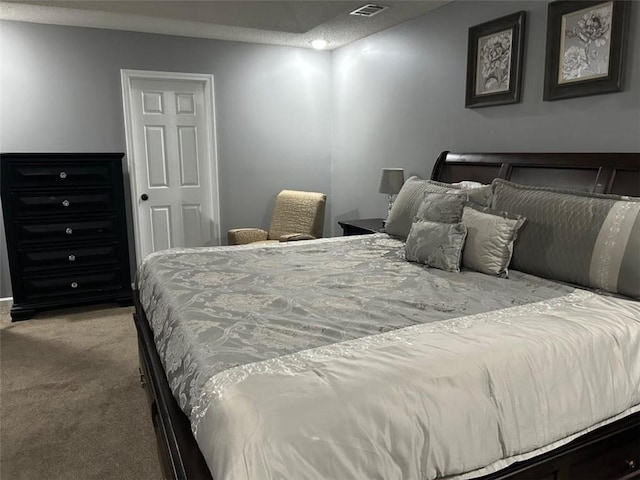 carpeted bedroom with visible vents