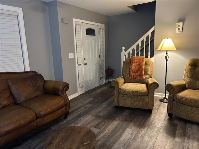 living room with baseboards, stairs, and dark wood finished floors