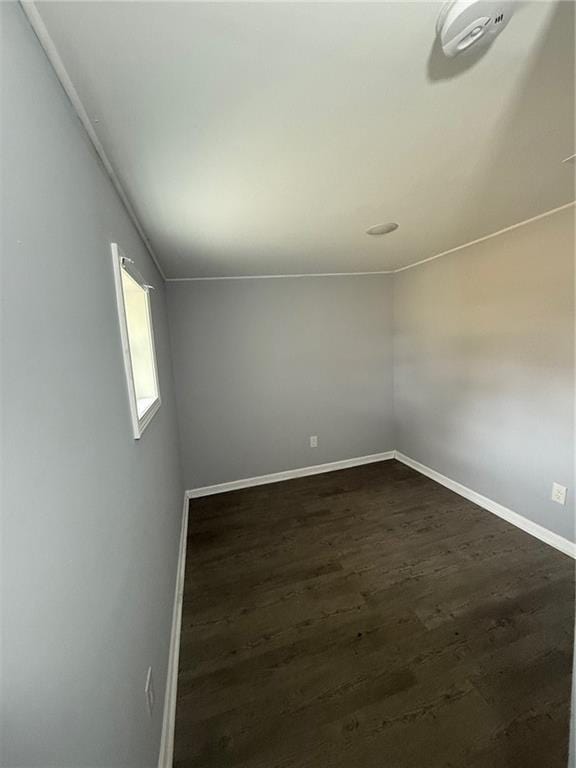 empty room with dark wood-type flooring