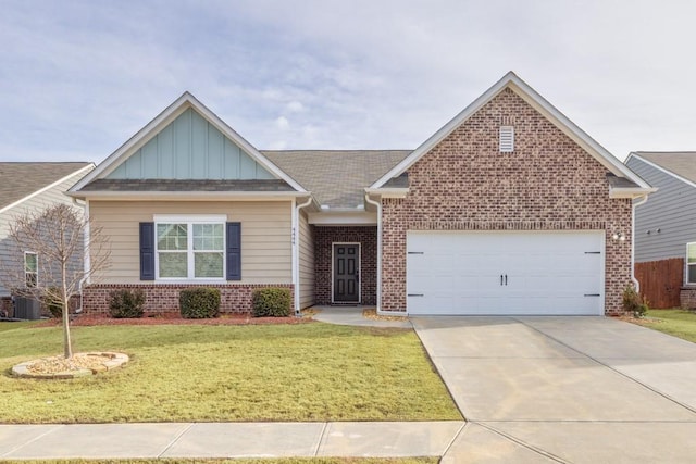 view of front of home featuring board and batten siding, a front yard, brick siding, and an attached garage