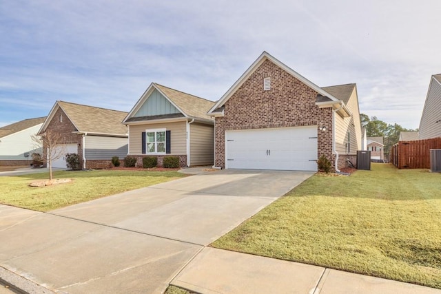 view of front of property featuring an attached garage, brick siding, fence, driveway, and a front lawn