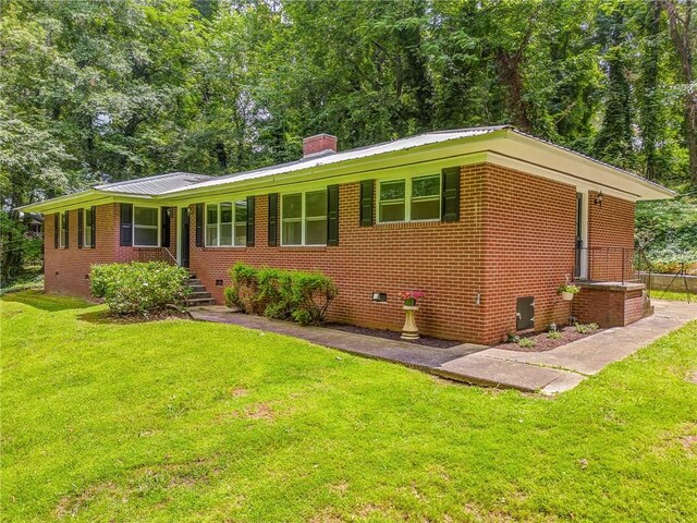 103 White Cir, Rockmart, GA 30153 - ranch-style house featuring crawl space, a front yard, a chimney, and brick siding