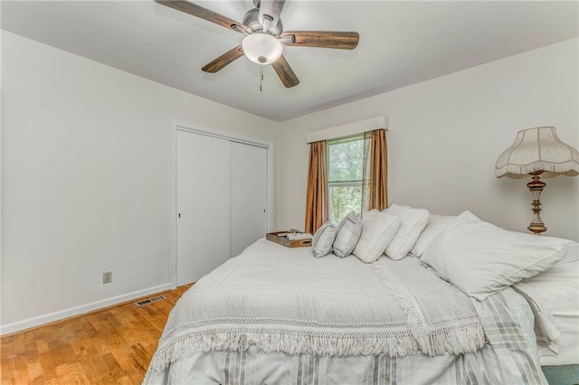 103 White Cir, Rockmart, GA 30153 - bedroom featuring a closet, baseboards, light wood-type flooring, and a ceiling fan