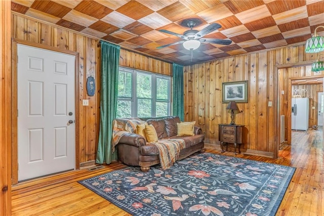 103 White Cir, Rockmart, GA 30153 - living area with wood ceiling, wooden walls, hardwood / wood-style floors, ceiling fan, and ornamental molding