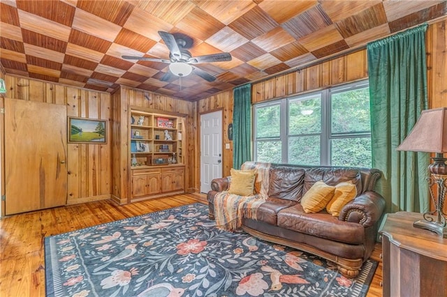 103 White Cir, Rockmart, GA 30153 - living room with wooden walls, wood ceiling, ceiling fan, and hardwood / wood-style floors