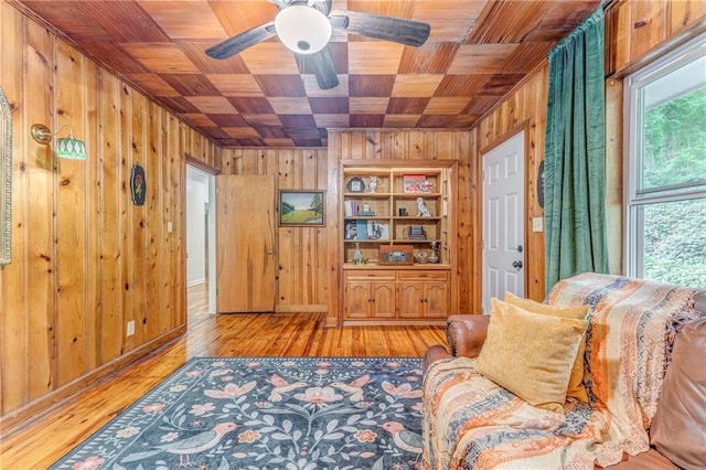 103 White Cir, Rockmart, GA 30153 - sitting room with wooden ceiling, wood walls, light wood-type flooring, and a ceiling fan