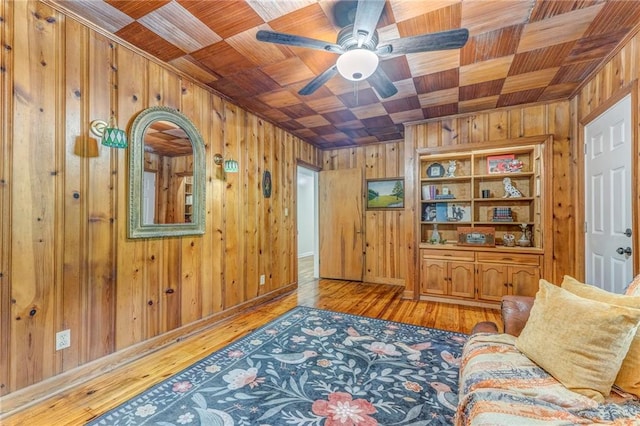 103 White Cir, Rockmart, GA 30153 - living room with wood walls, wood ceiling, ceiling fan, and hardwood / wood-style flooring