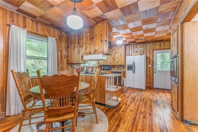 103 White Cir, Rockmart, GA 30153 - dining room featuring wood ceiling, wood walls, and light wood-type flooring