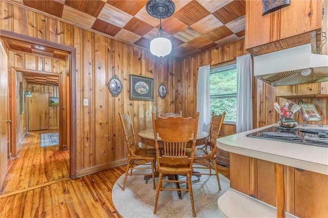 103 White Cir, Rockmart, GA 30153 - dining room with wood ceiling, wooden walls, and light wood-type flooring