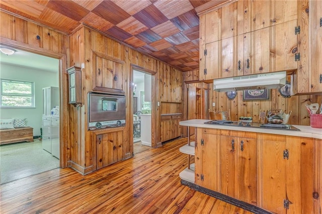 103 White Cir, Rockmart, GA 30153 - kitchen with wooden walls, under cabinet range hood, wood ceiling, independent washer and dryer, and light countertops