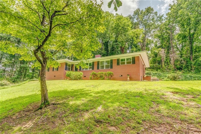 103 White Cir, Rockmart, GA 30153 - view of front facade featuring brick siding, a front lawn, a chimney, and crawl space