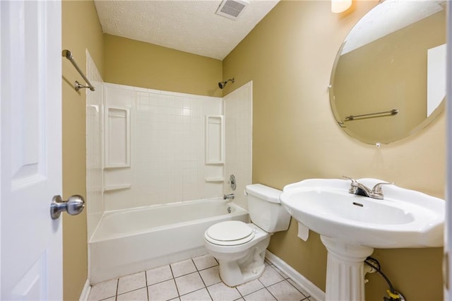 bathroom featuring visible vents, toilet, a textured ceiling,  shower combination, and tile patterned flooring