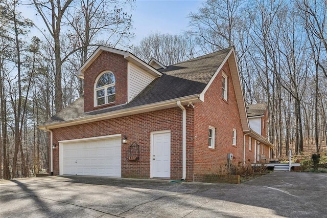 view of side of home with a garage