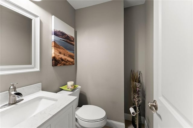 4635 Dawsonville Hwy, Gainesville, GA 30506 - half bathroom featuring vanity, toilet, and baseboards