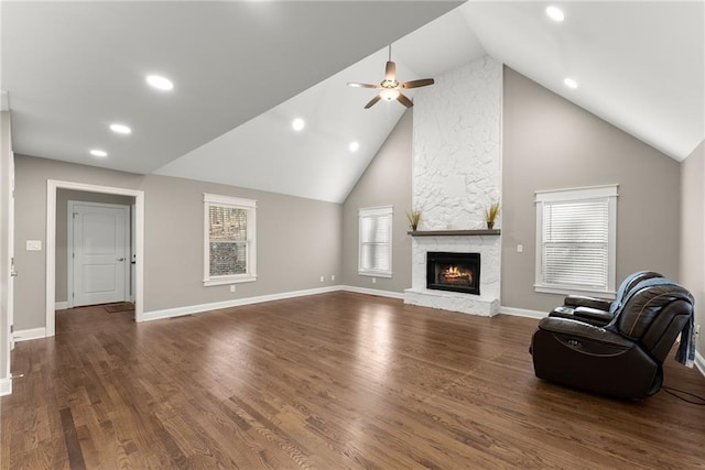 4635 Dawsonville Hwy, Gainesville, GA 30506 - living room featuring baseboards, ceiling fan, a stone fireplace, dark wood-style floors, and high vaulted ceiling