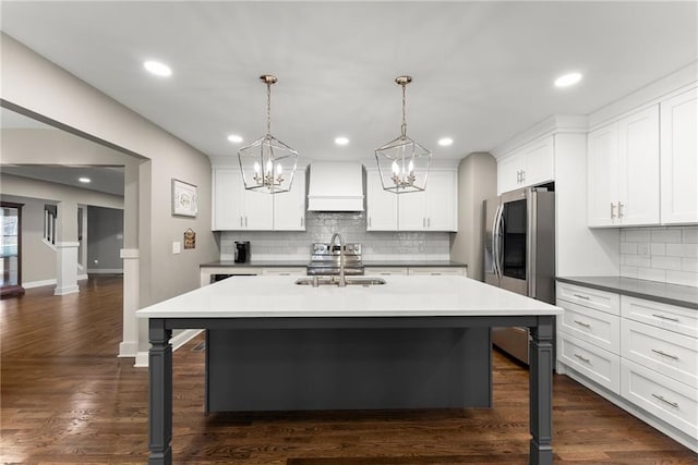 4635 Dawsonville Hwy, Gainesville, GA 30506 - kitchen with a breakfast bar, stainless steel fridge with ice dispenser, dark wood-style flooring, and a sink