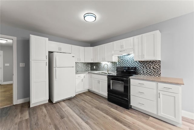 4635 Dawsonville Hwy, Gainesville, GA 30506 - kitchen featuring freestanding refrigerator, a sink, decorative backsplash, black electric range, and under cabinet range hood