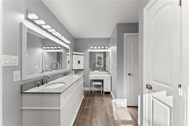 4635 Dawsonville Hwy, Gainesville, GA 30506 - full bath featuring a sink, baseboards, wood finished floors, and double vanity