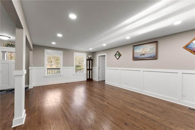 4635 Dawsonville Hwy, Gainesville, GA 30506 - unfurnished living room featuring a wainscoted wall, a decorative wall, recessed lighting, and dark wood-style flooring