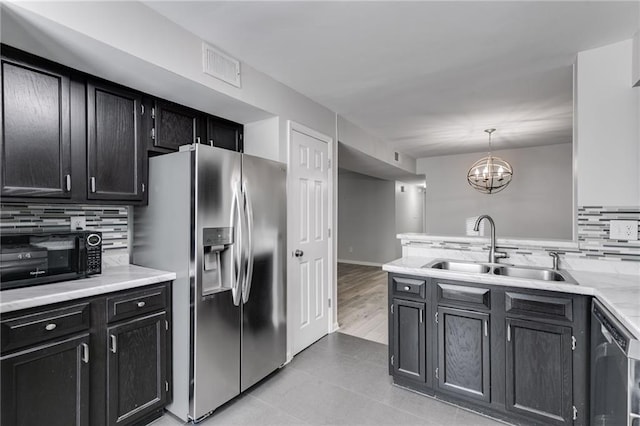 2135 N Forest Trl, Dunwoody, GA 30338 - kitchen with appliances with stainless steel finishes, a sink, backsplash, and light countertops