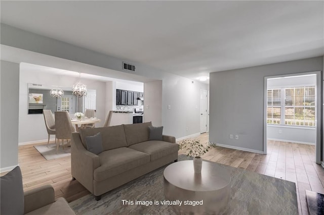 2135 N Forest Trl, Dunwoody, GA 30338 - living area with light wood finished floors, plenty of natural light, and baseboards