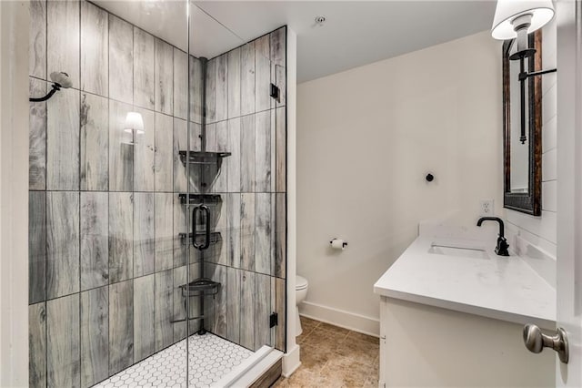 bathroom with walk in shower, vanity, and toilet