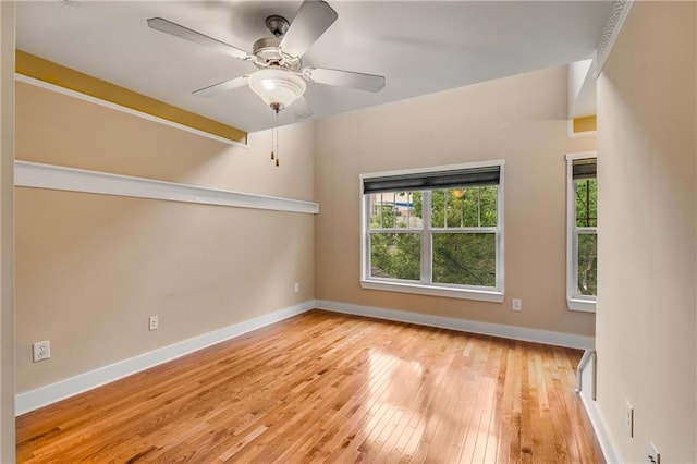 empty room featuring ceiling fan and light wood-type flooring