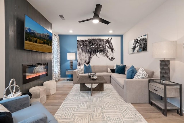 104 Chapel Hill Pkwy, Newnan, GA 30263 - living area with light wood-type flooring, visible vents, a fireplace, and ceiling fan