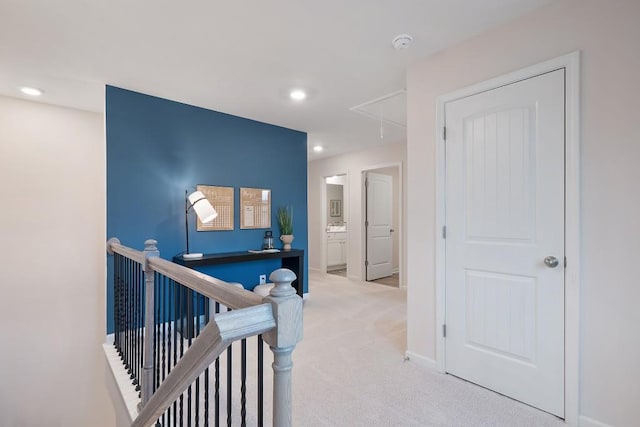 104 Chapel Hill Pkwy, Newnan, GA 30263 - hallway with recessed lighting, attic access, baseboards, an upstairs landing, and light colored carpet
