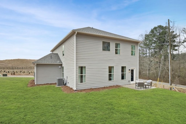 104 Chapel Hill Pkwy, Newnan, GA 30263 - rear view of house featuring a yard, roof with shingles, a patio area, and central AC