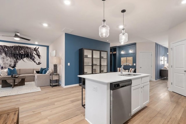 104 Chapel Hill Pkwy, Newnan, GA 30263 - kitchen with a sink, white cabinetry, light countertops, stainless steel dishwasher, and light wood-style floors