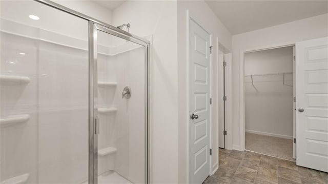 1316 Village Brook Dr, Dacula, GA 30019 - full bath featuring a stall shower, stone finish flooring, and a spacious closet