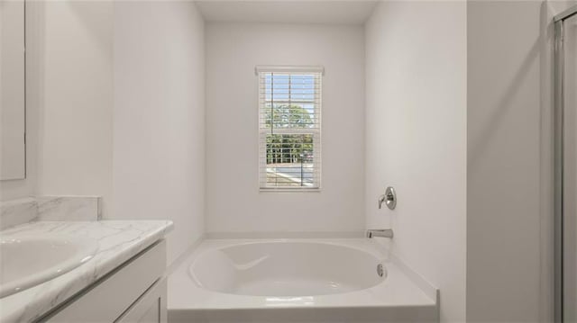 1316 Village Brook Dr, Dacula, GA 30019 - bathroom with vanity and a bath