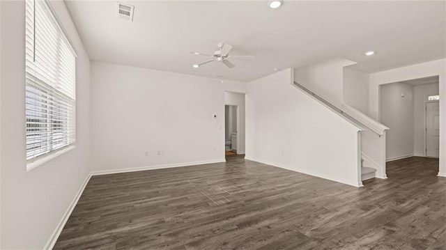 1316 Village Brook Dr, Dacula, GA 30019 - empty room featuring stairs, ceiling fan, healthy amount of natural light, dark wood-style floors, and recessed lighting